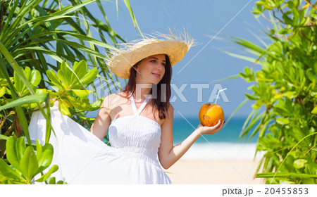 woman with coconut cocktail woman with coconut cocktail 20455853