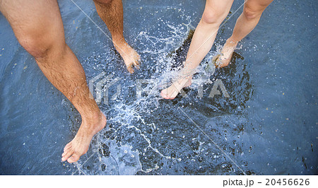 Feet in puddle 20456626