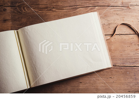 Photo album on wooden desk Photo album on wooden desk 20456859