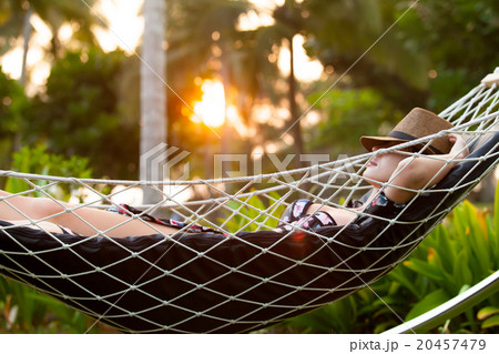 woman relaxing in a hammock woman relaxing in a hammock 20457479