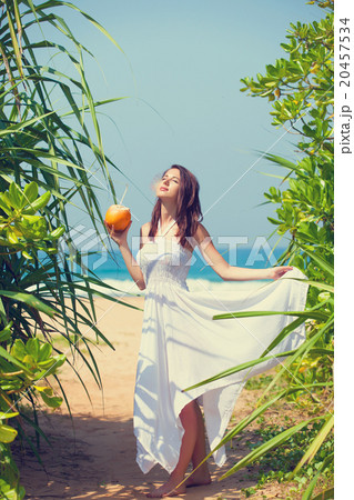 woman with coconut cocktail 20457534