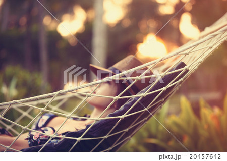 woman relaxing in a hammock woman relaxing in a hammock 20457642