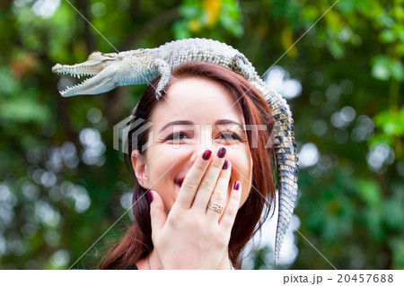 Young woman with crocodile Young woman with crocodile 20457688