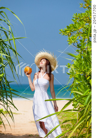 woman with coconut cocktail woman with coconut cocktail 20457700