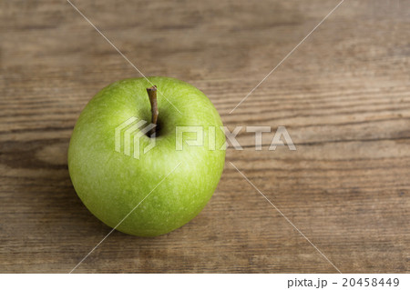 Green apple on wooden background 20458449