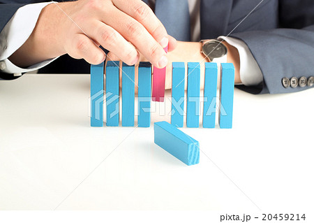 Businessman pushing out  wooden block with hand 20459214