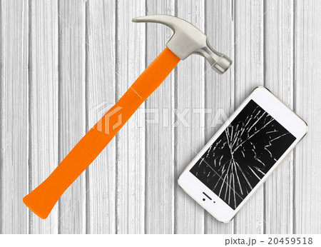 Modern broken mobile phone and hamster on wooden 20459518