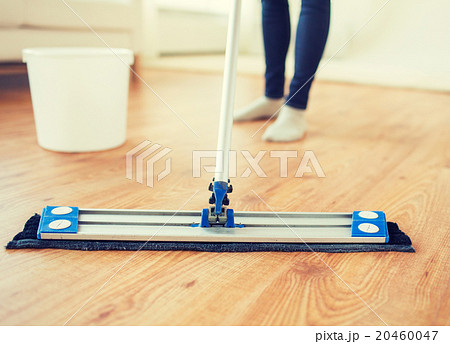 close up of woman with mop cleaning floor at home close up of woman with mop cleaning floor at home 20460047