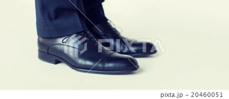 close up of man legs in elegant shoes with laces close up of man legs in elegant shoes with laces 20460051