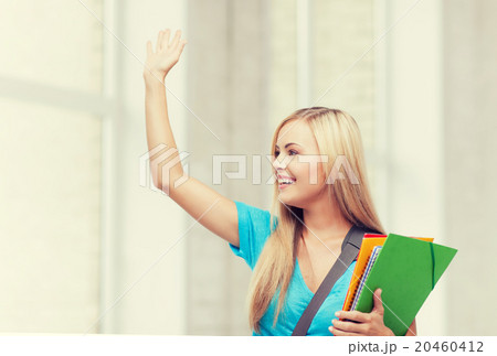 student with folders 20460412
