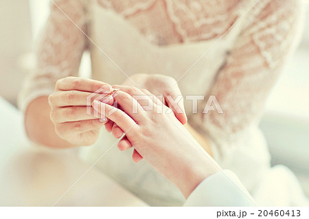 close up of lesbian couple hands with wedding ring 20460413