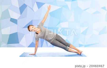 woman making yoga in side plank pose on mat woman making yoga in side plank pose on mat 20460467