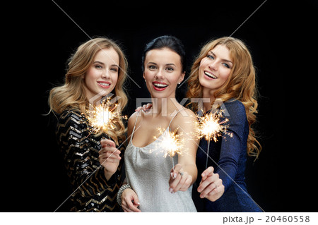happy young women dancing at night club disco 20460558