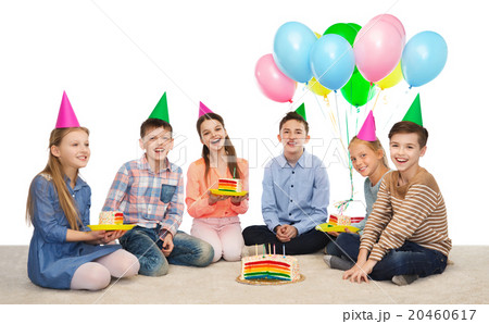 happy children in party hats with birthday cake happy children in party hats with birthday cake 20460617