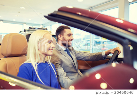 happy couple sitting in car at auto show or salon happy couple sitting in car at auto show or salon 20460646
