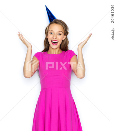 happy young woman or teen girl in party cap 20461036
