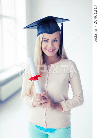 student in graduation cap with certificate 20461217