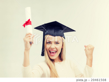 student in graduation cap with certificate 20461508