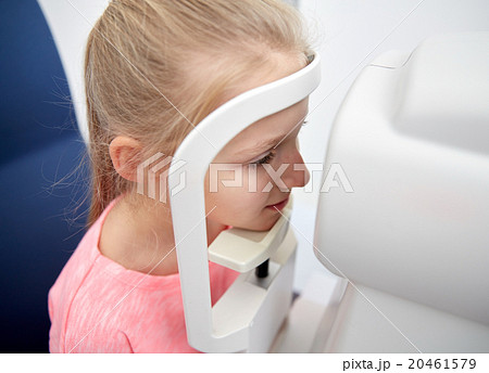 optician with tonometer and patient at eye clinic 20461579