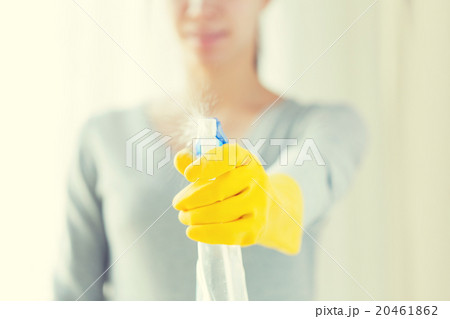 close up of happy woman with cleanser spraying close up of happy woman with cleanser spraying 20461862