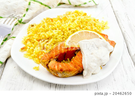 Salmon with lemon and rice on board 20462650