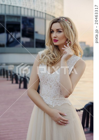 Young girl at river bank in the city 20463317