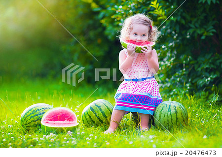 Little girl eating watermelon 20476473