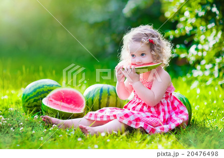 Little girl eating watermelon 20476498