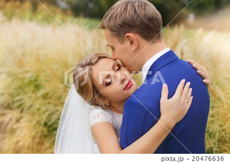 Newlyweds on a walk in the countryside Newlyweds on a walk in the countryside 20476636