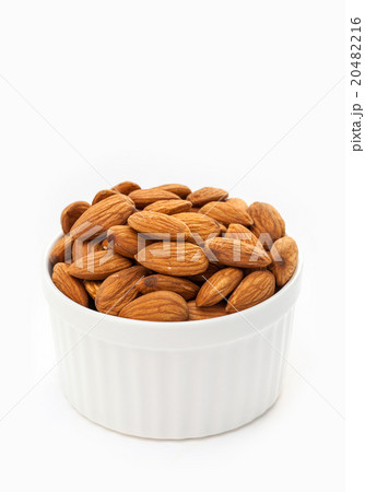 Almond seed in white cup on white background 20482216