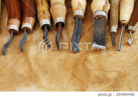 carving tool closeup on wooden background 20490480