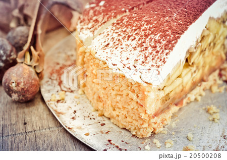 Banoffee pie on wooden table in soft light Banoffee pie on wooden table in soft light 20500208