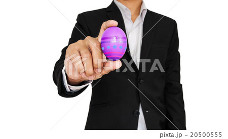 Businessman holding Easter egg, isolated on white Businessman holding Easter egg, isolated on white 20500555