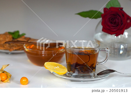 Transparent cup of tea with honey 20501913