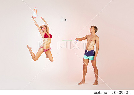 Couple playing badminton Couple playing badminton 20509289
