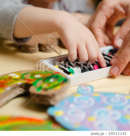 Little female baby painting with colorful paints 20511142