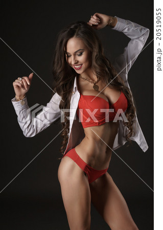 Sexy girl with a flirtatious smile in lingerie.   20519055
