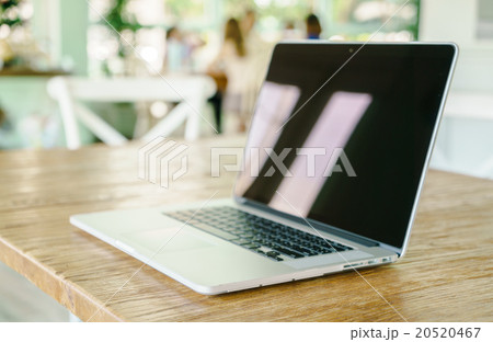 laptop computer on wood table 20520467