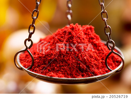Red chili powder in vintage bowl weights 20526719