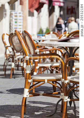 Little tables and chairs in small street cafe 20532184