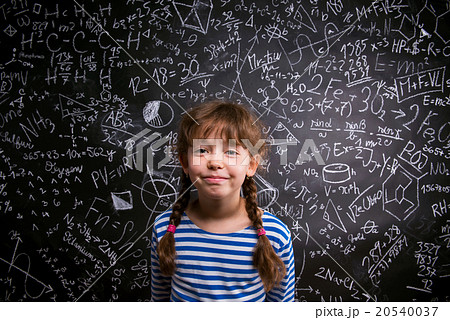 Girl  with two braids, big blackboard with 20540037