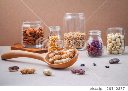 Various beans and nuts in the glass jars. 20540877
