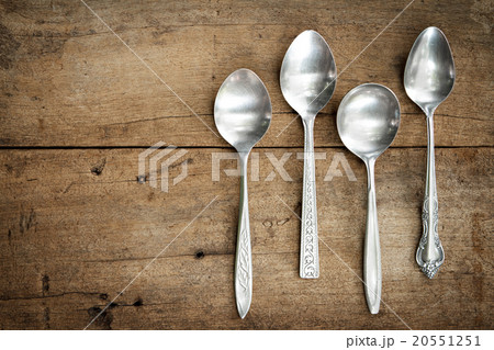 Vintage spoons on wooden background. 20551251