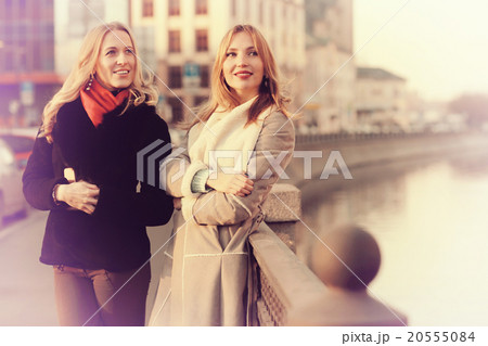 two cheerful blonde for a walk in the city 20555084