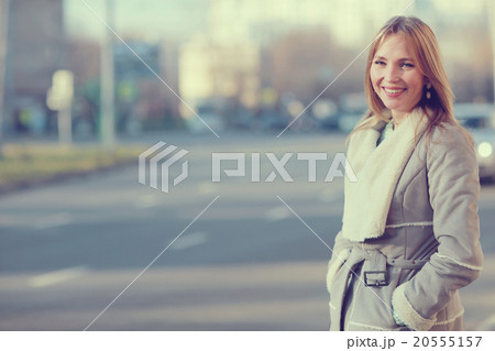 Spring warm blonde portrait in the city Spring warm blonde portrait in the city 20555157