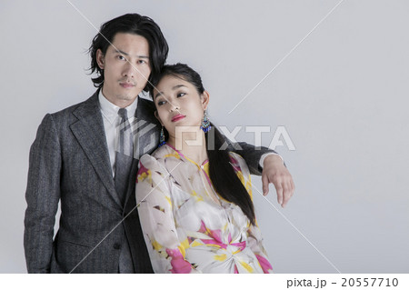 スーツとワンピースの男女の写真素材