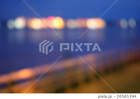 Blurred bokeh of night light at riverside. 20565394