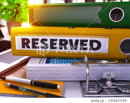 Reserved on Yellow Office Folder. Toned Image. 20565594