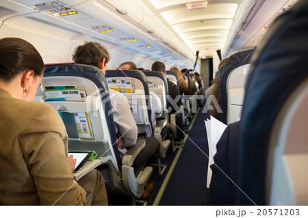 Passengers on the airplane. 20571203