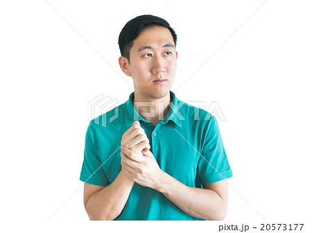 Serious Asian man thinking about something Serious Asian man thinking about something 20573177